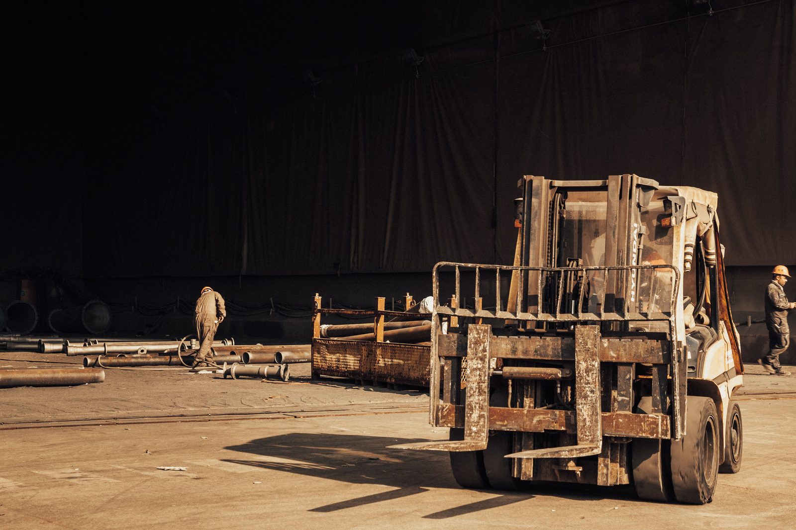 Crew transporting a structure on a flatbed trailer